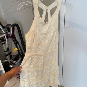 Off-white/cream colored lace dress.